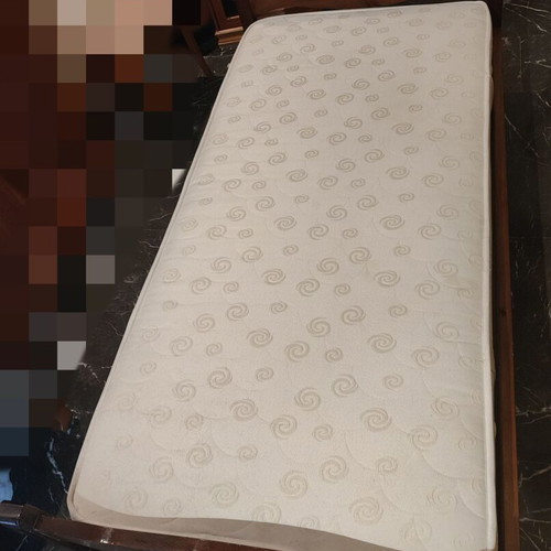 Solid wood single bed with clean mattress