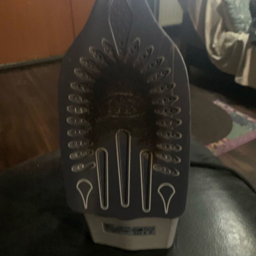 Ceramic steam iron used with steam and water outlets