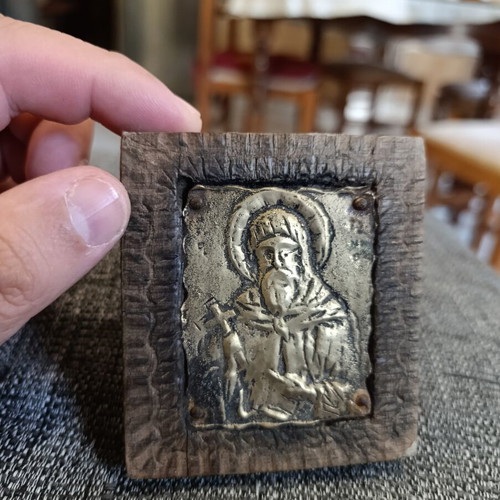 Saint Anthony brass icon on wood
