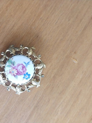 Vintage brooch with porcelain medallion and flowers used