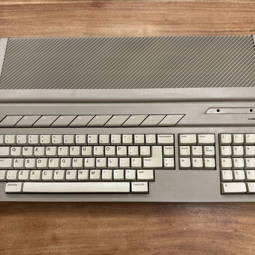 Atari 1040STFM with Atari SM124 monitor, original mouse and Greek manual used