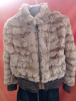 Short fur jacket used with zipper and knitted cuffs and waistband