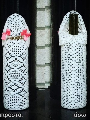 Handmade decorative wine bottle with knitted poodle design