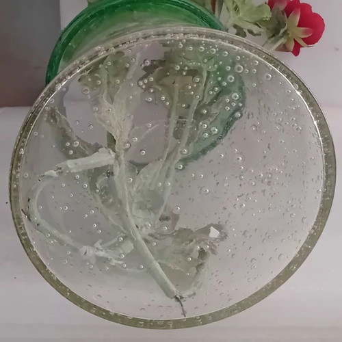 Large glass vase with fabric flowers