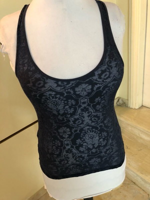 Sleeveless women's top used, blue with embossed details