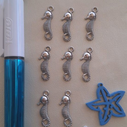 8 metal seahorse charms and 2 wooden starfish