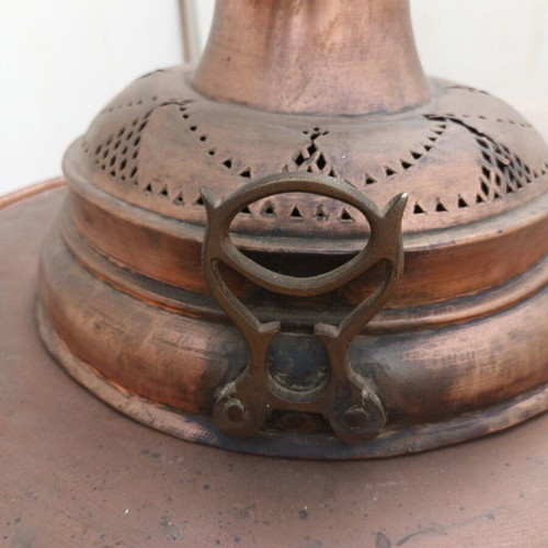 Old copper brazier used with brass handles and decorative bird