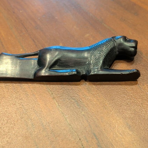Wooden paper cutter used with handmade African art carving