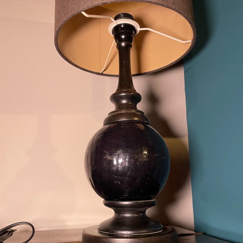 Black table lamp with glass base and gray-black shade