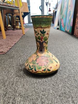 Decorative ceramic vase used with hand-painted floral motifs