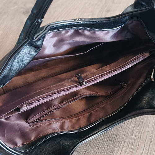 Handbag new with strap, black synthetic leather