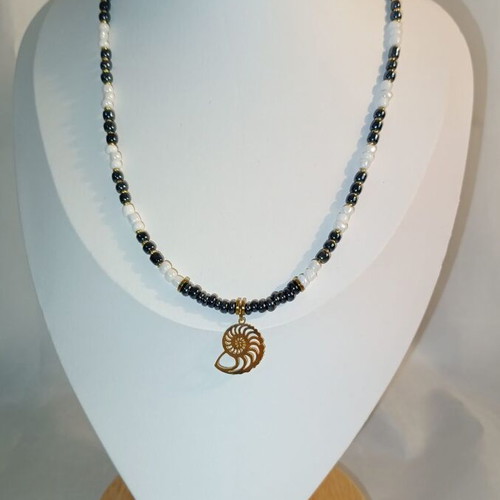 Magic Shell Necklace new, black and white beads with gold shell spiral