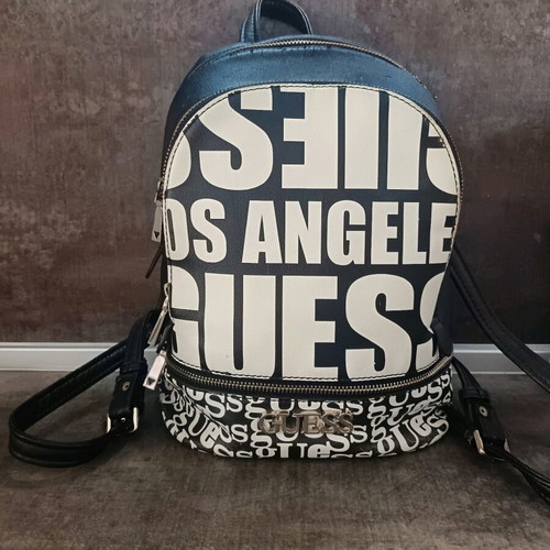Guess backpack used with leather cracks