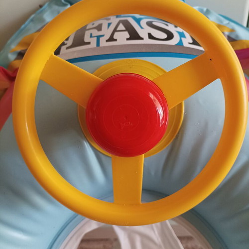 Inflatable car baby float used with leg holder