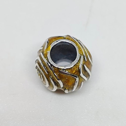 Silver charm bead with gold glitter enamel spiral design like new