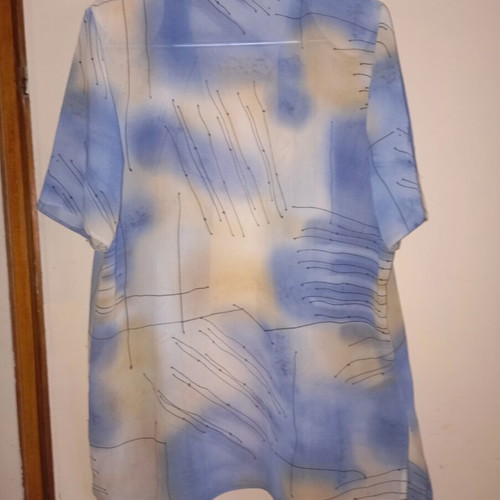 Light vintage women's shirt with short sleeves, buttons, collar, abstract print