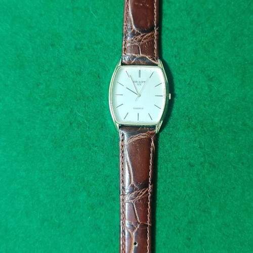 Orient VX wristwatch like new, gold color, leather strap