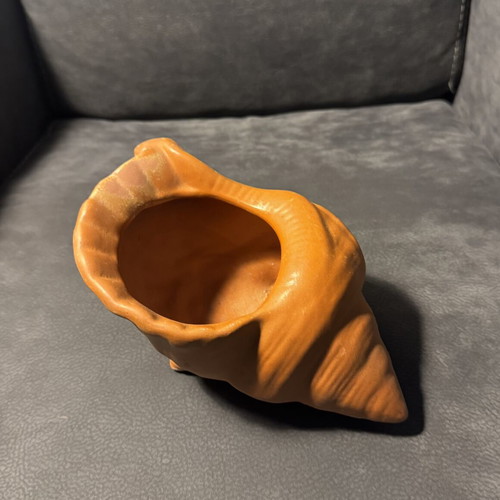 Clay flowerpot in shell shape like new