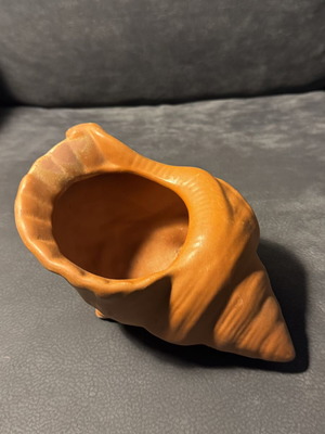 Clay flowerpot in shell shape like new