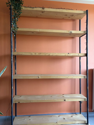 Wooden bookshelf with black metal pipes and gold accents, like new