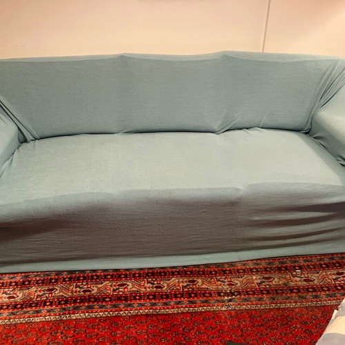 Three-seater sofa bed with extra cover and cushions