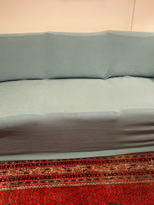 Three-seater sofa bed with extra cover and cushions