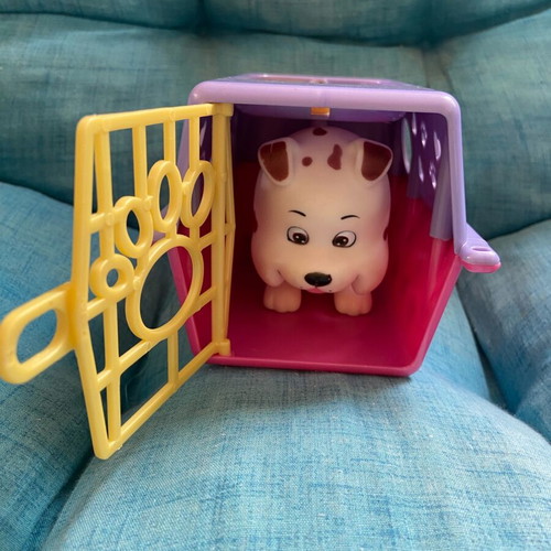 Simba collectible dog figure with carrying cage used