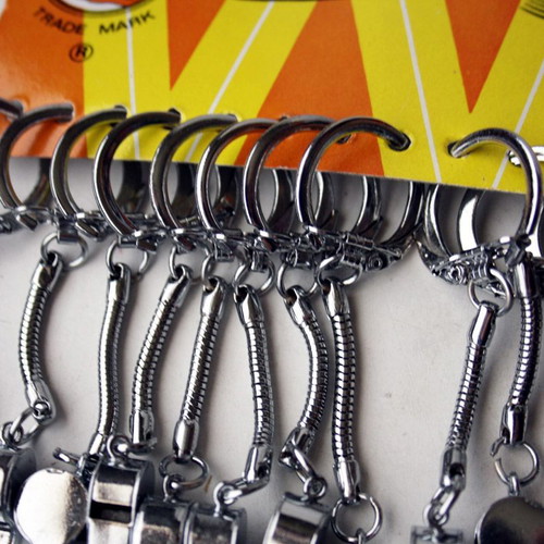 Card with 12 old metal whistle keychains from 1980s new