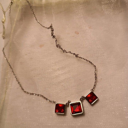 Stainless steel necklace like new with red and silver details