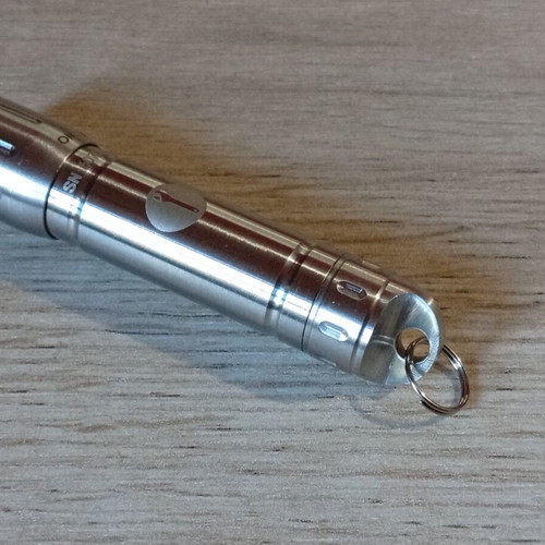 Mini stainless steel LED flashlight like new, AAA battery