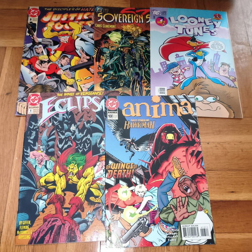 DC Comics bundle with Justice Society 8, Sovereign Seven 1, Looney Tunes 170, Eclipso 4, Anima 13