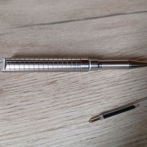 Mini titanium pen like new with Frag Pattern and carbide tip