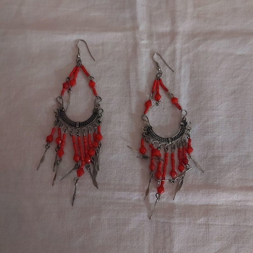 Long earrings used in red color