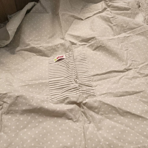 Nursing cover with storage pouch used