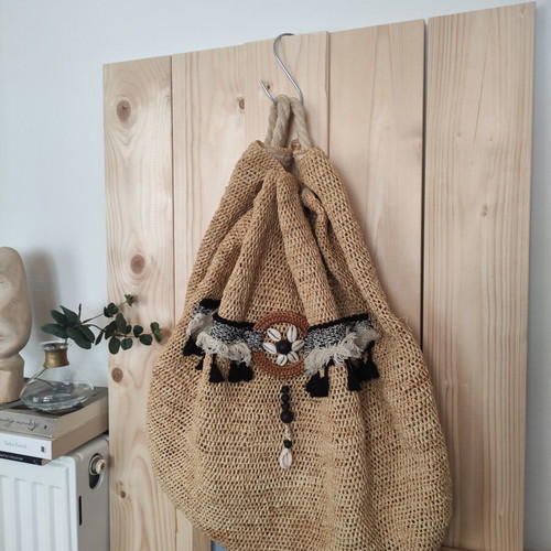Boho straw backpack used with shells and rope straps, resort style