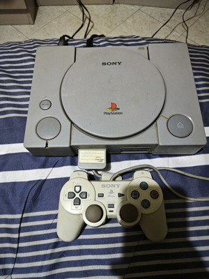 Sony PlayStation 1 console used with original controller and memory card