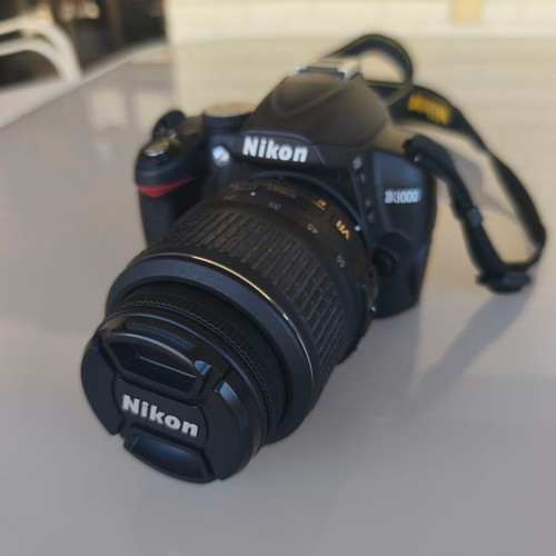 Nikon D3000 camera with AF-S 18-55mm f/3.5-5.6 lens and bag