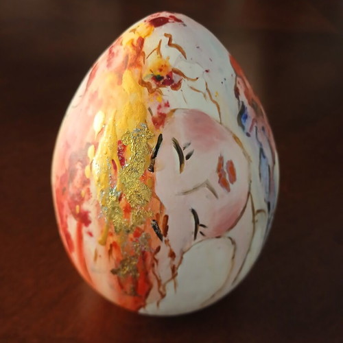Hand-painted ceramic egg with floral and female figure design