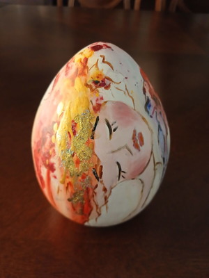 Hand-painted ceramic egg with floral and female figure design