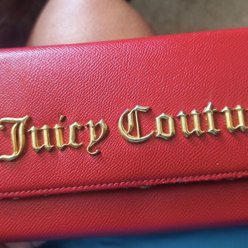 Juicy Couture red wallet used with side wear on gold details