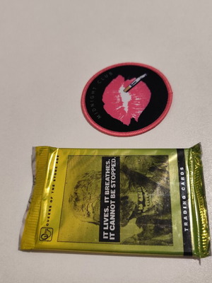 Queens of the Stone Age patch and trading cards set new