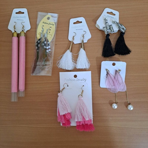 Jewelry set new with seven pairs of earrings, five chokers, and chains