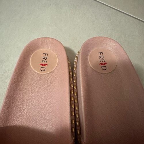 Keep Fred pink soft slippers like new with gold studs