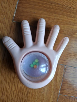 Bebe toy used with palm and rotating beads