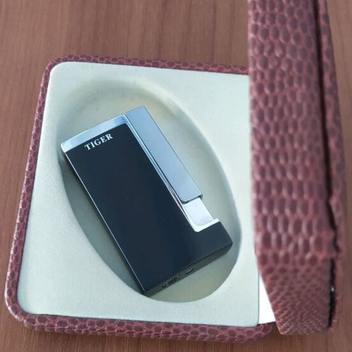 Windproof lighter new in leather-type case, unused