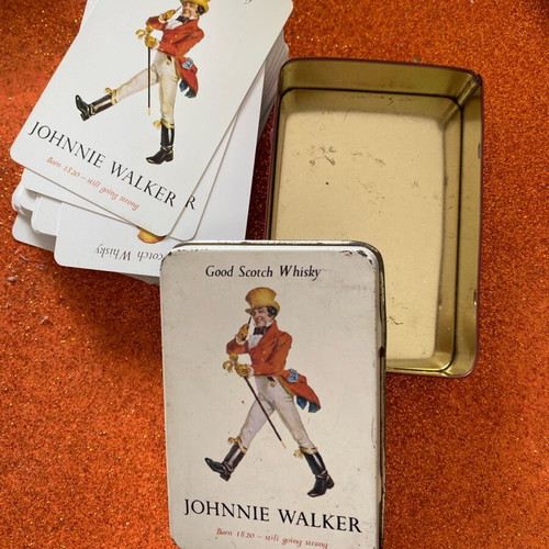 Johnnie Walker collectible playing cards in metal box used