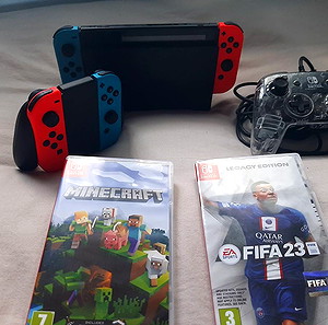 nintendo switch αποτελείται από 3 controllers, fifa 23, mincraft και τη βάση για την τηλεόραση  σε άριστη κατάσταση