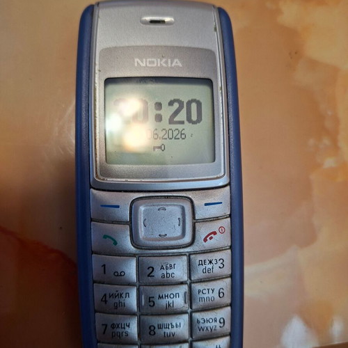 Nokia 1110i used, gray phone with charger