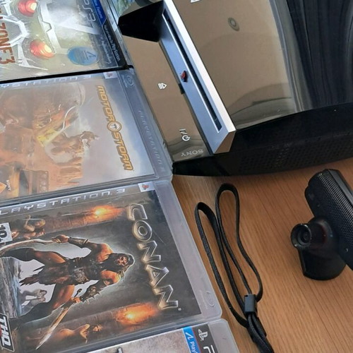 Playstation 3 like new with Move and 14 games