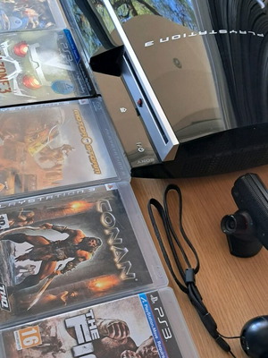 Playstation 3 like new with Move and 14 games